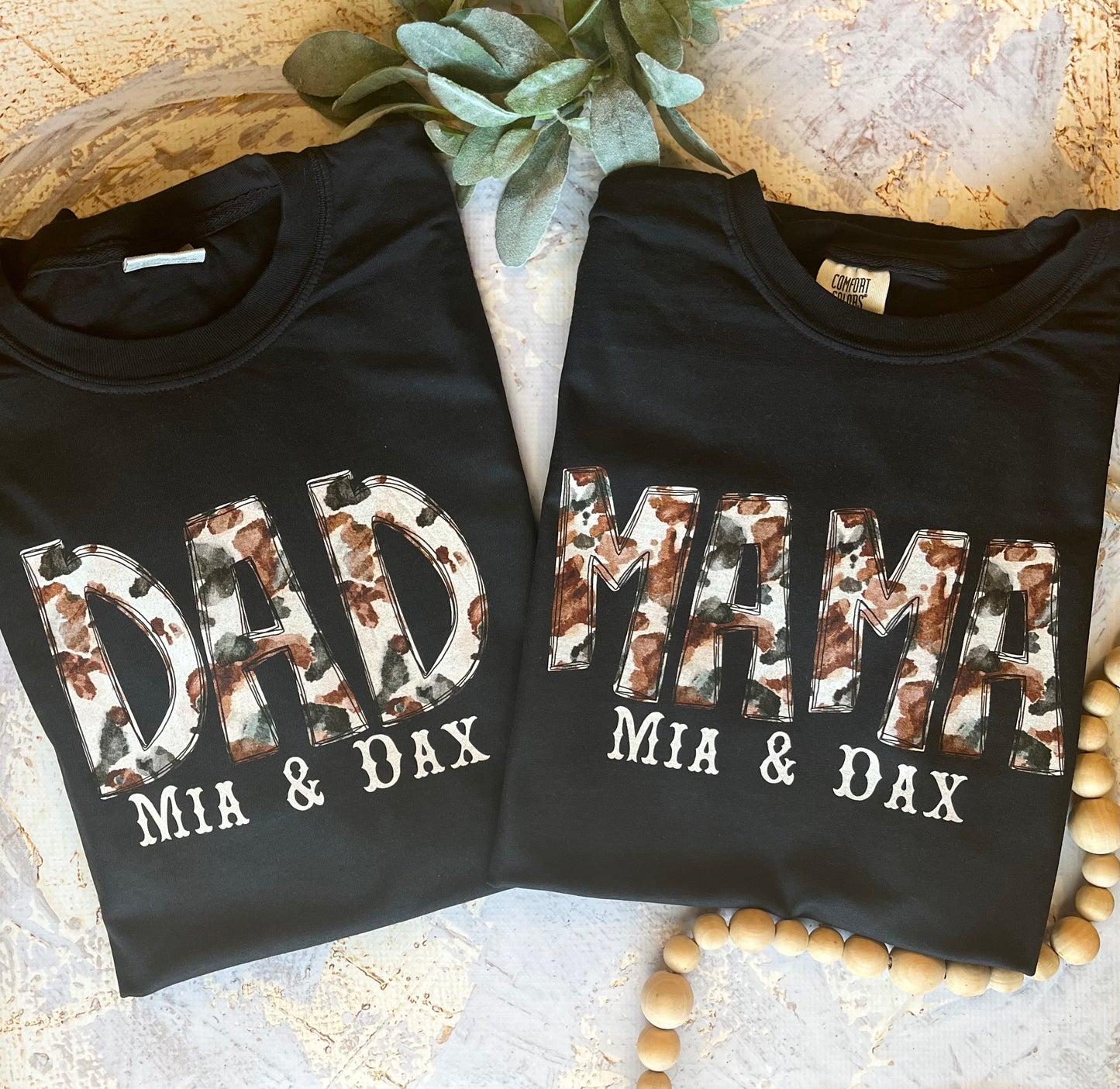 Cowhide Mama and Dad Tees in Black