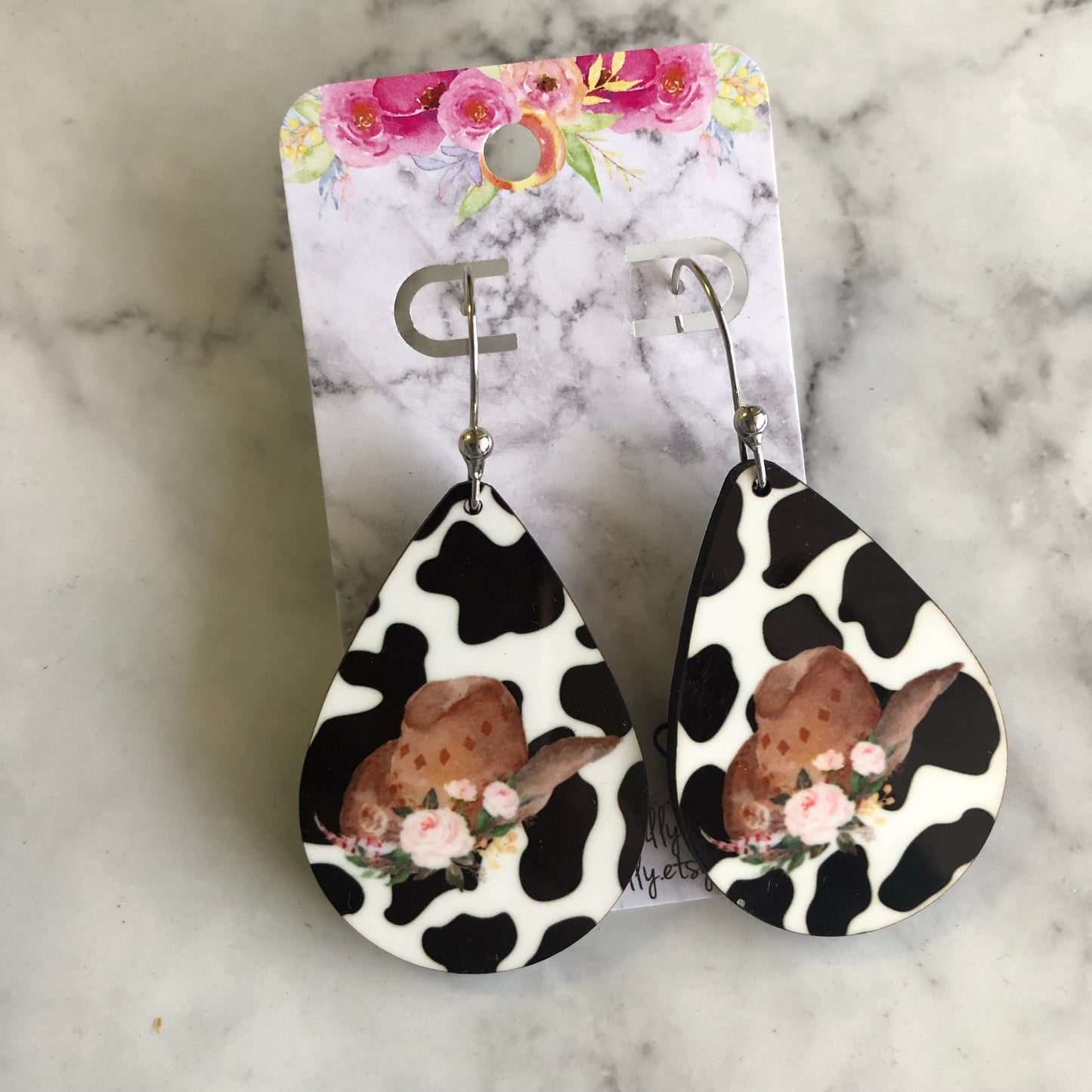 Sally Cowgirl Hat Earrings in Cow Print